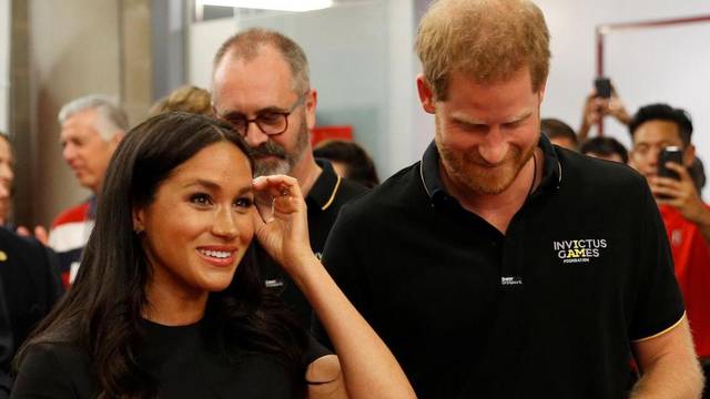 Britain's Prince Harry and Meghan, Duchess of Sussex attend the Boston Red Sox v New York Yankees match in London