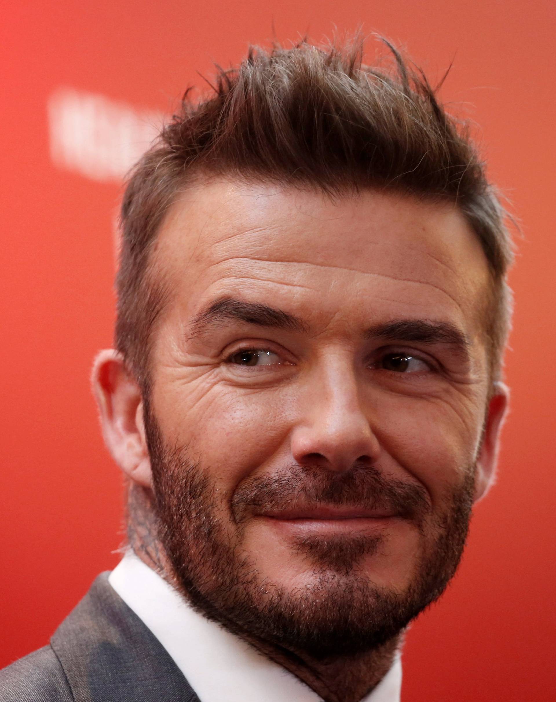 FILE PHOTO: David Beckham attends an insurance company charity event in Jakarta