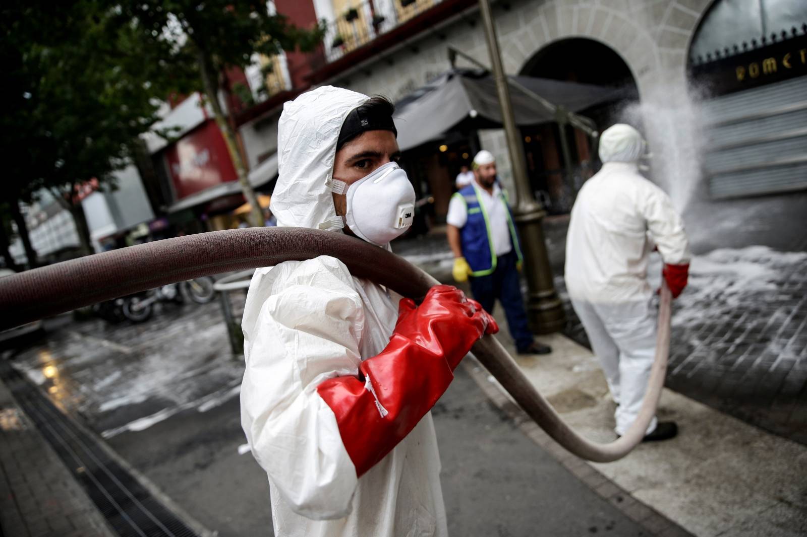 Local workers clean the streets as a precautionary measure, amid the coronavirus disease (COVID-19) outbreak, in Concepcion