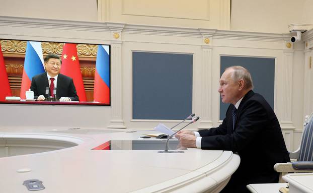 FILE PHOTO: Putin and Xi hold talks via videolink