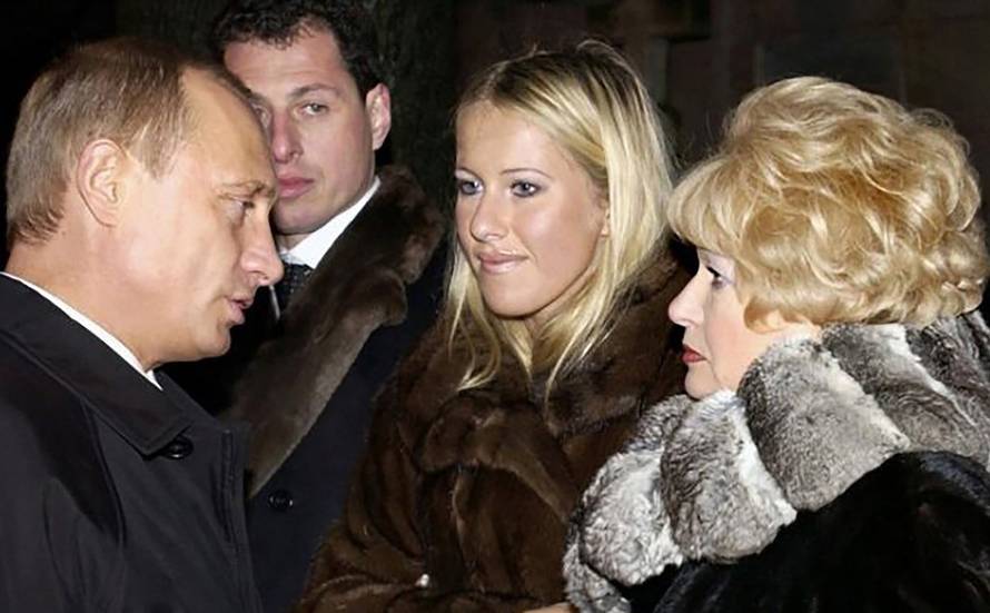 Vladimir Putin, Lyudmila Narusova, and Ksenia Sobchak pictured together in St Petersburg in November 2003.
