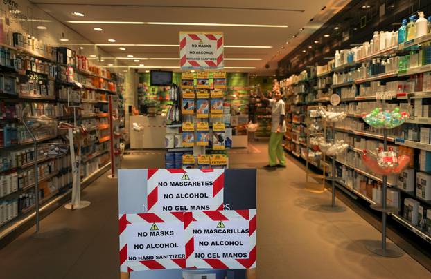 A pharmacy with information signs about masks and hand sanitizers is seen amidst concerns over Spain