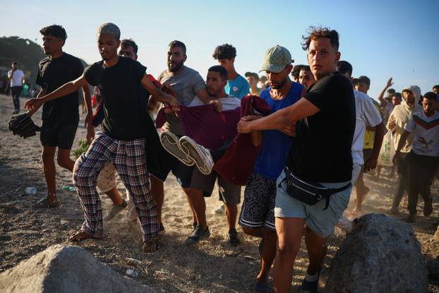 Mass crossings of migrants on foot and by sea from Morocco into Spanish territory, in Ceuta