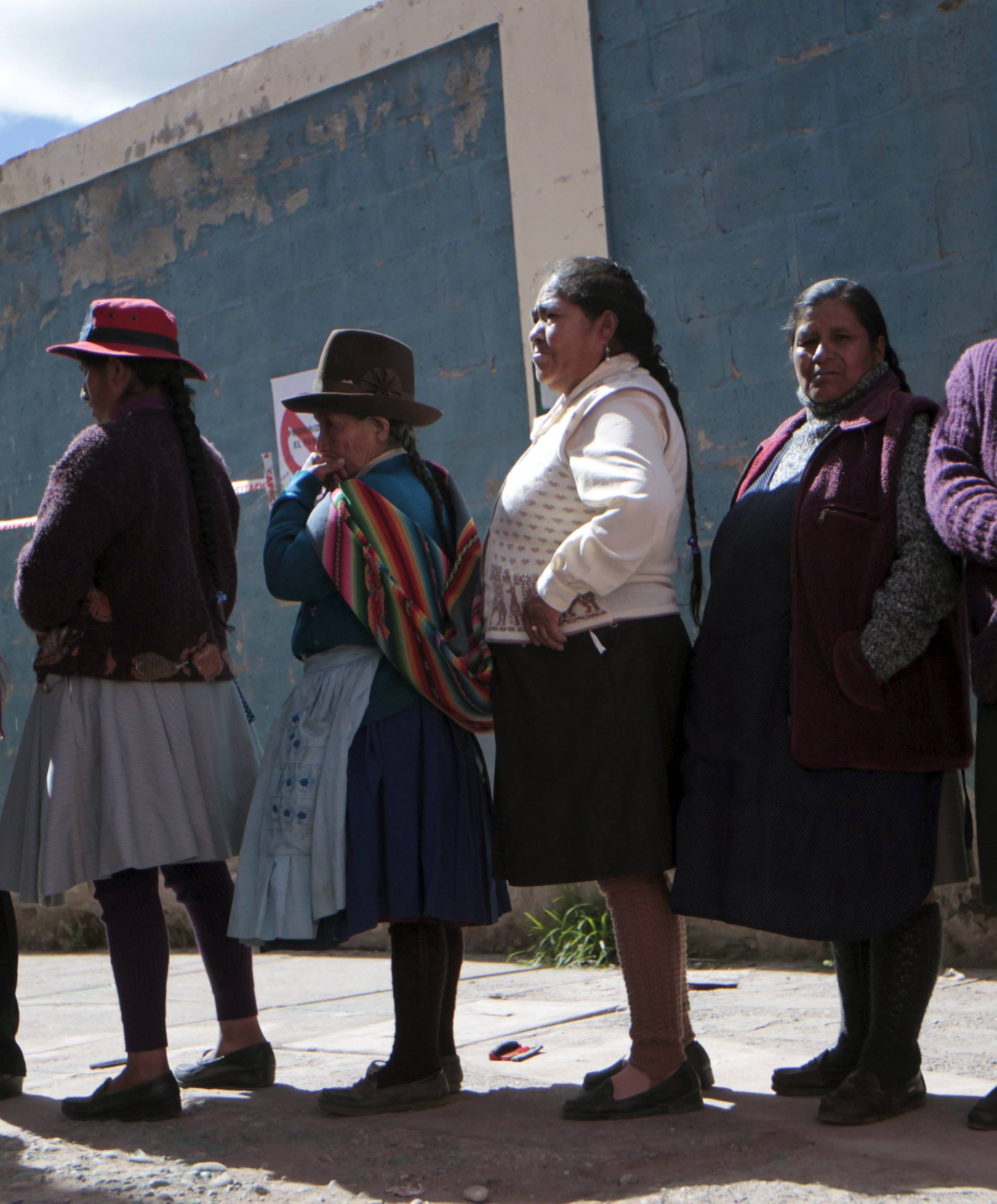 People wait on line to vote at a polling station during presidential election in Cuzco