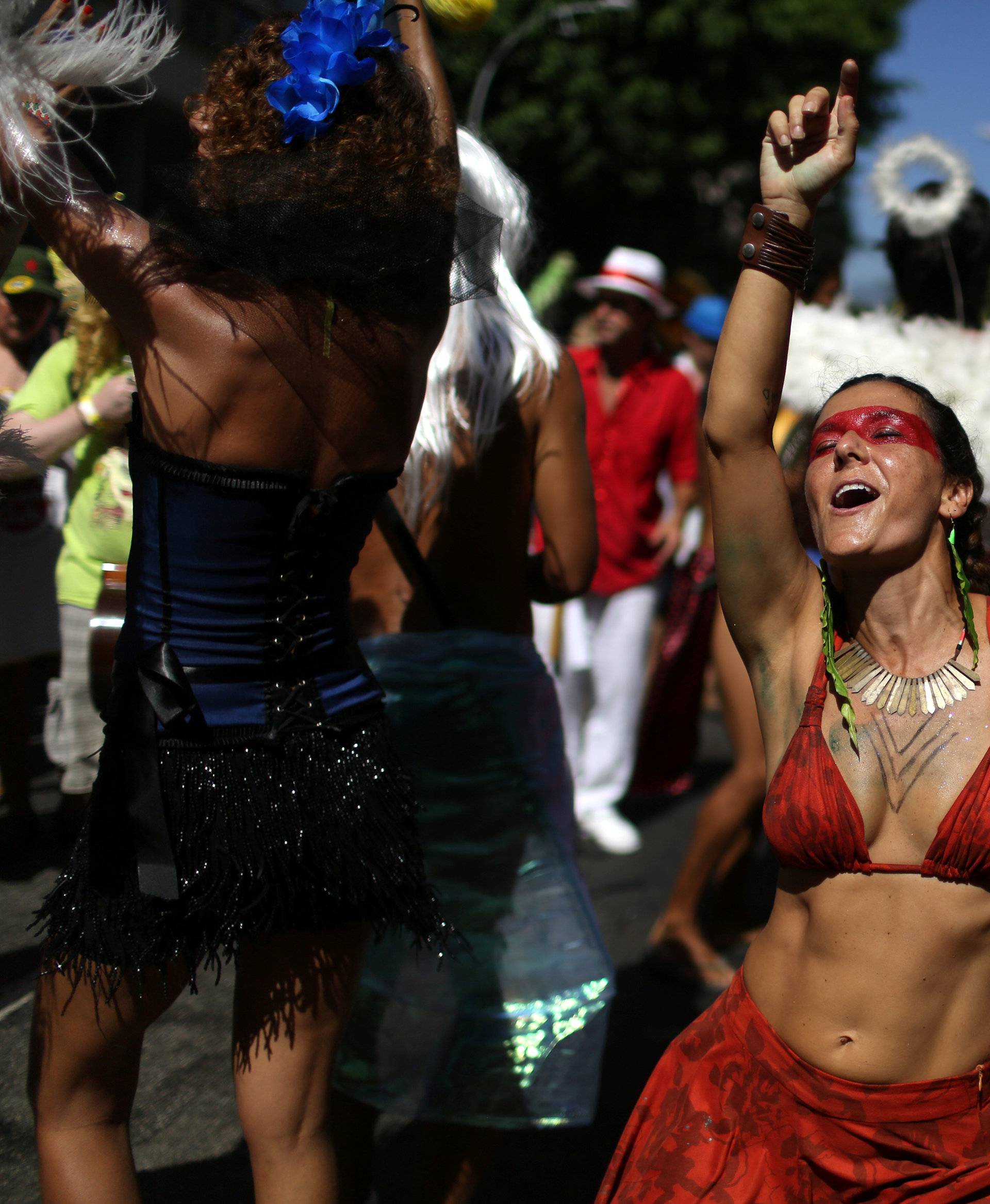 Revellers take part in the annual block party Cordao de Boitata during pre-carnival festivities in Rio Janeiro