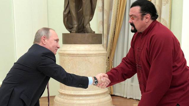 FILE PHOTO: Russia's President Putin meets U.S. actor Seagal in Moscow