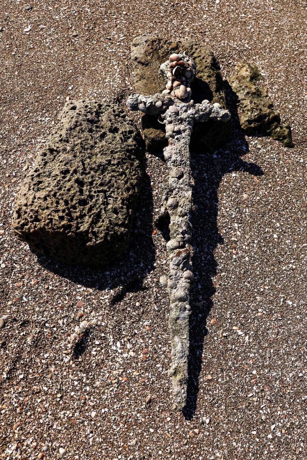 A sword believed to have belonged to a Crusader who sailed to the Holy Land almost a millennium ago was found in Caesarea