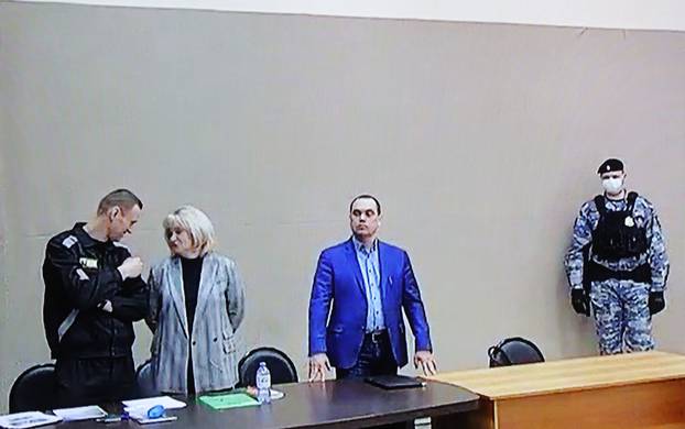 Jailed Russian opposition leader Alexei Navalny attends a court hearing in Pokrov