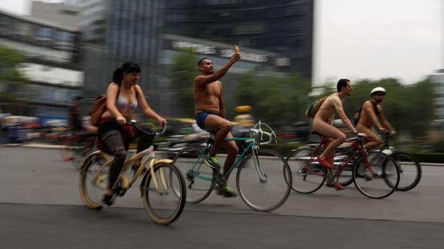 Cyclists participate in the World Naked Bike Ride, which organisers say is a protest against reliance on cars and oil, in downtown Mexico City