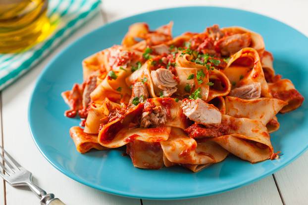 Pappardelle pasta with tuna, in tomato sauce.