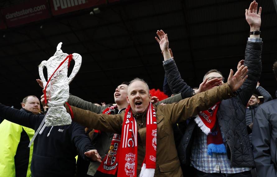 Lincoln fans celebrate after the match