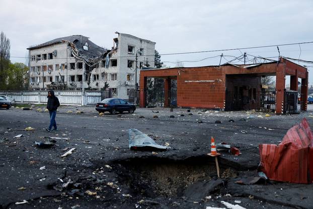 Rescuers work at the site of a Russian missile strike, amid Russia's attack on Ukraine, in Kyiv
