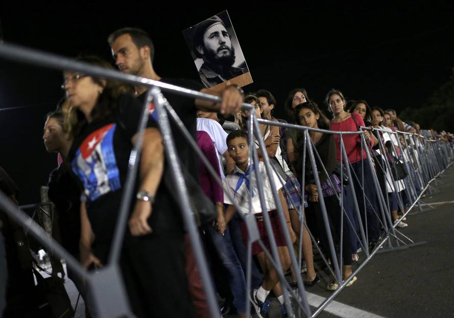 People wait in line to pay tribute to Cuba's late President Fidel Castro at the Jose Marti Memorial in Revolution Square in Havana