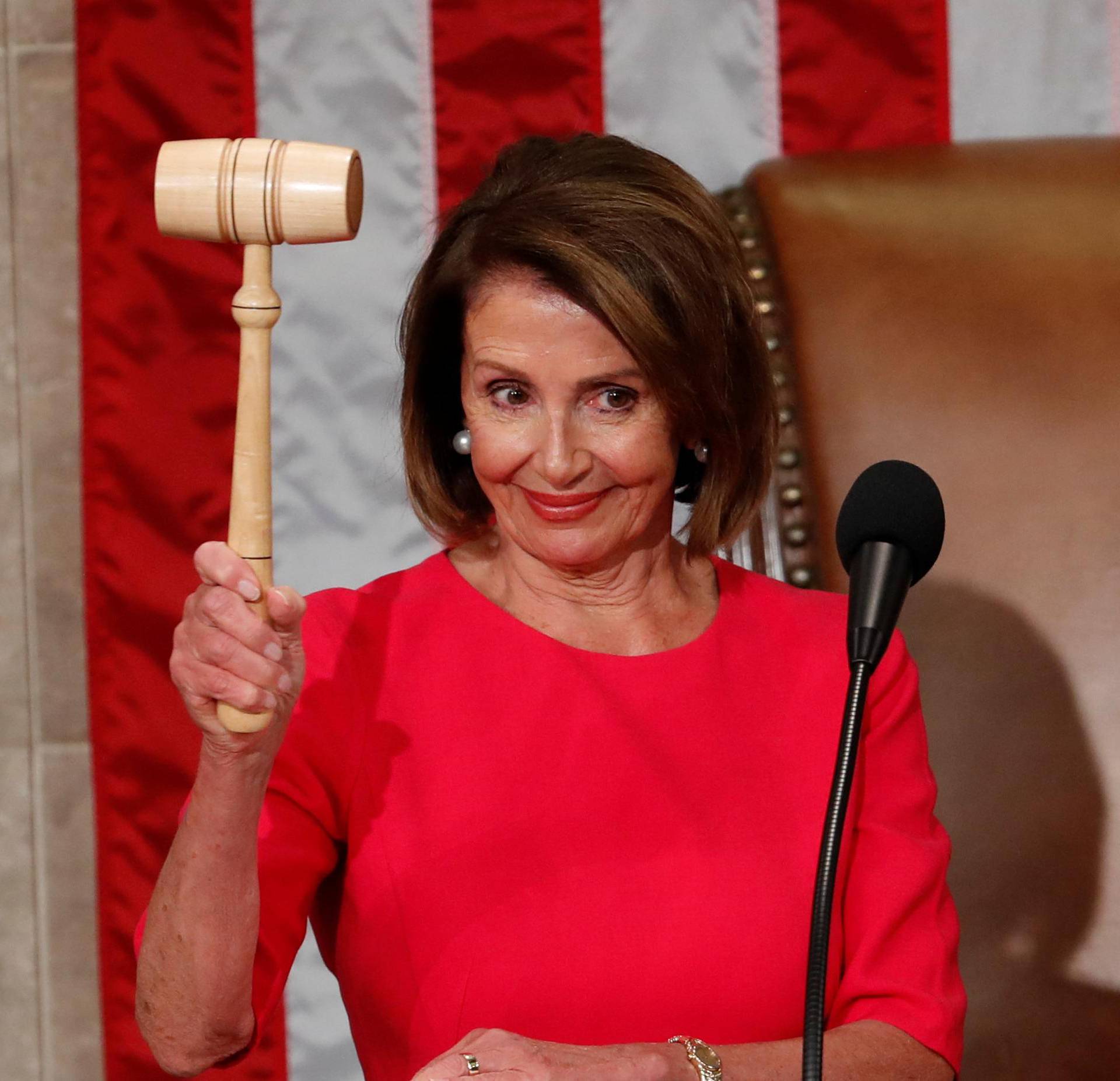 House Speaker-delegate Nancy Pelosi (D-CA) raises the gavel after being elected as House Speaker  in Washington