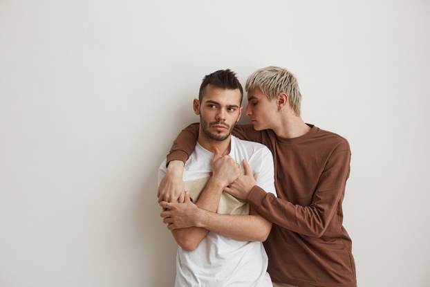 Modern Gay Couple on White
