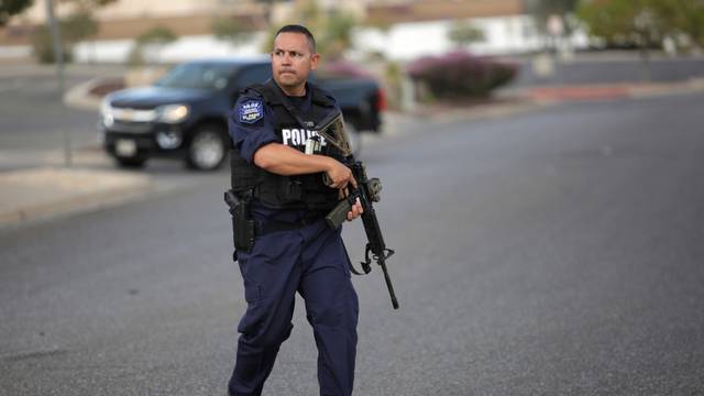A police officer is seen after a mass shooting at a Walmart in El Paso