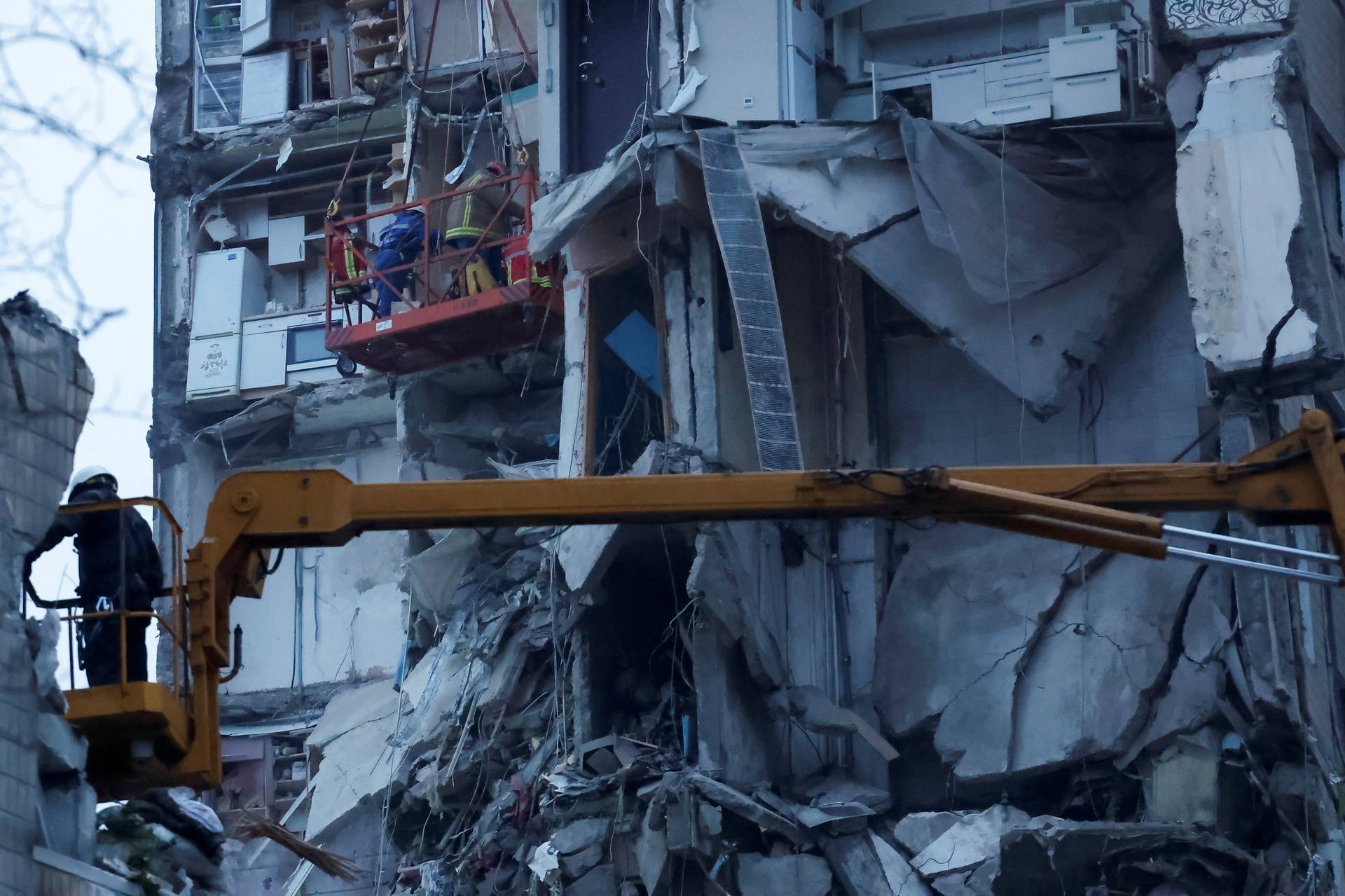 Aftermath of Dnipro apartment block destruction following missile strike