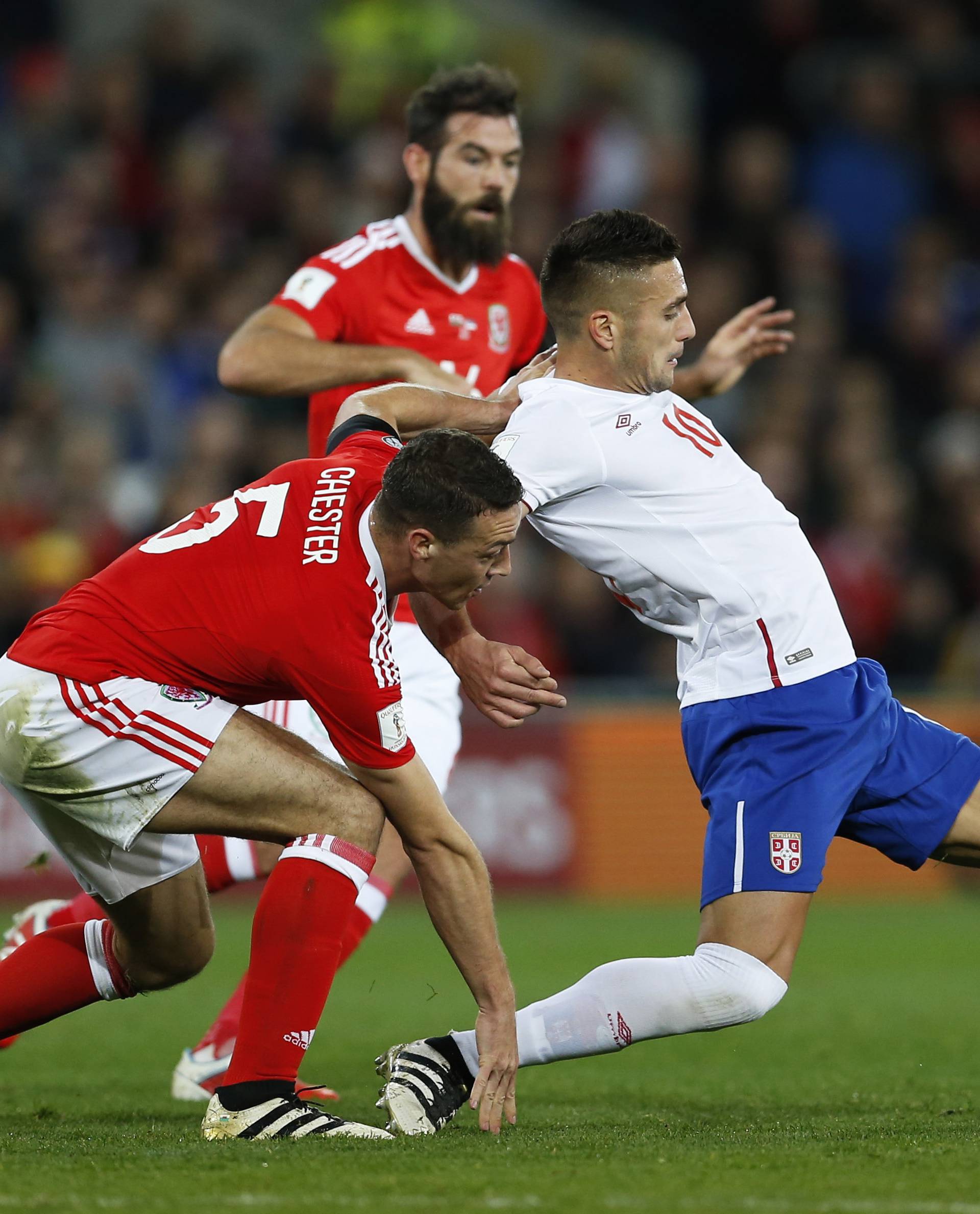 Serbia's Dusan Tadic in action with Wales' James Chester