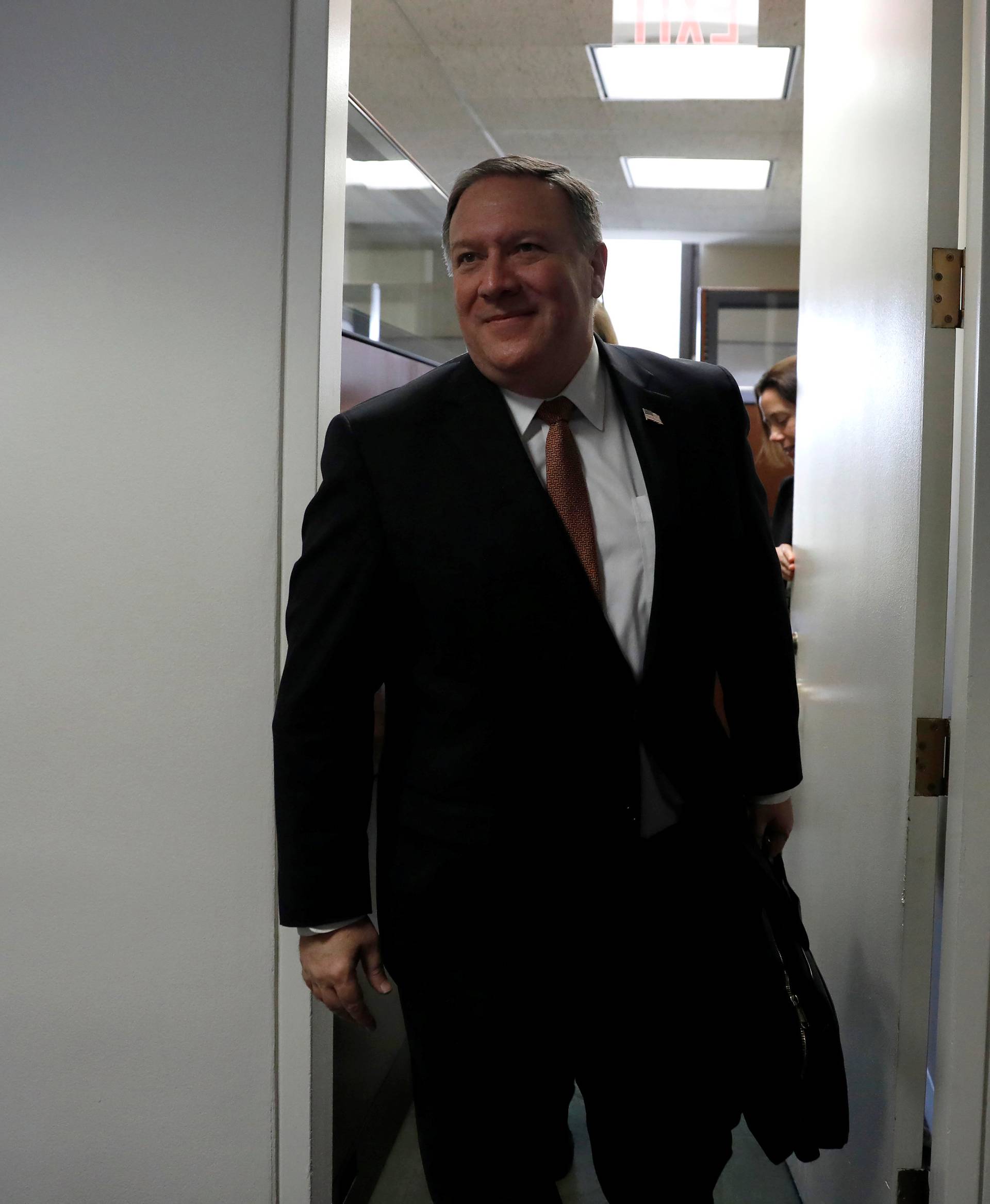 CIA Director Mike Pompeo, President Donald Trump's nominee to be Secretary of State, leaves a meeting with Sen. Mark Warner (D-VA) on Capitol Hill in Washington