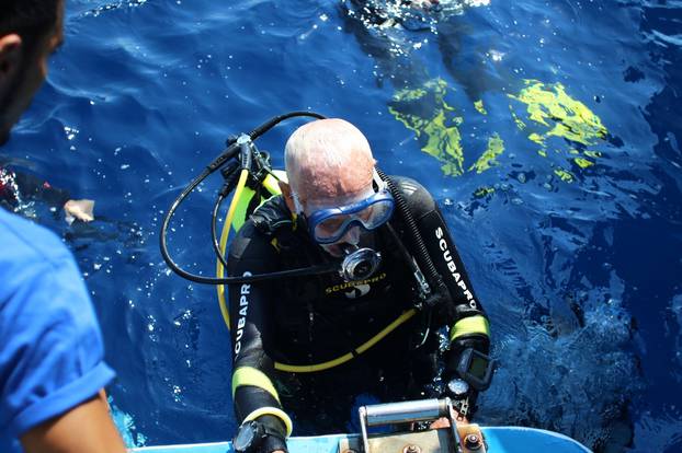 Ray Woolley, diver and World War Two veteran, emerges from the water after breaking a new diving record as he turns 96 by taking the plunge to explore the Zenobia, a cargo ship wreck off the Cypriot town of Larnaca