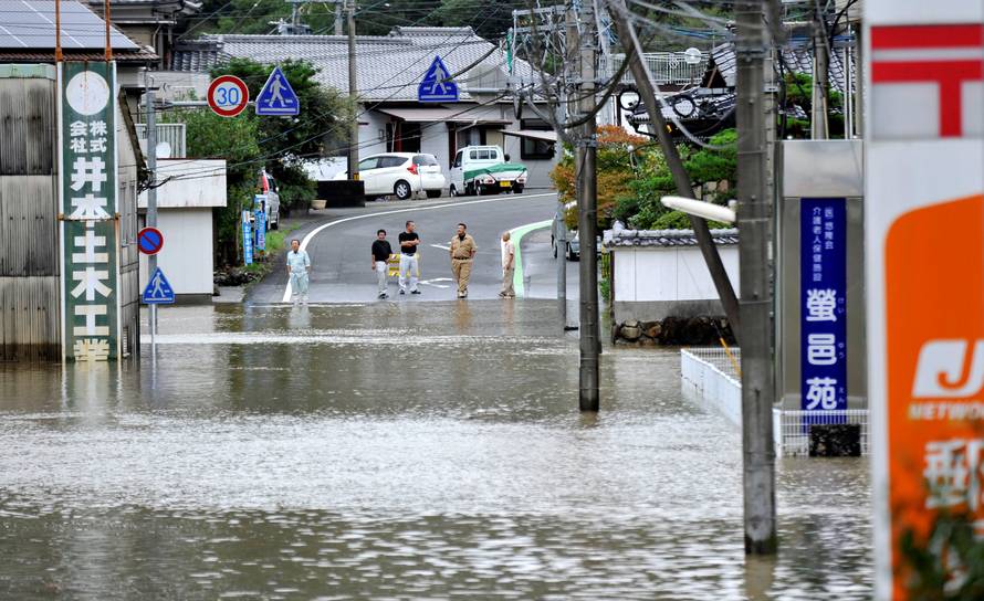 Roads are flooded due to heavy rains caused by Typhoon Malakas in Nobeoka, Japan
