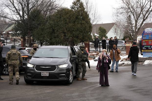 Border Patrol commander Greg Bovino's convoy stops at a gas station in Columbia Heights