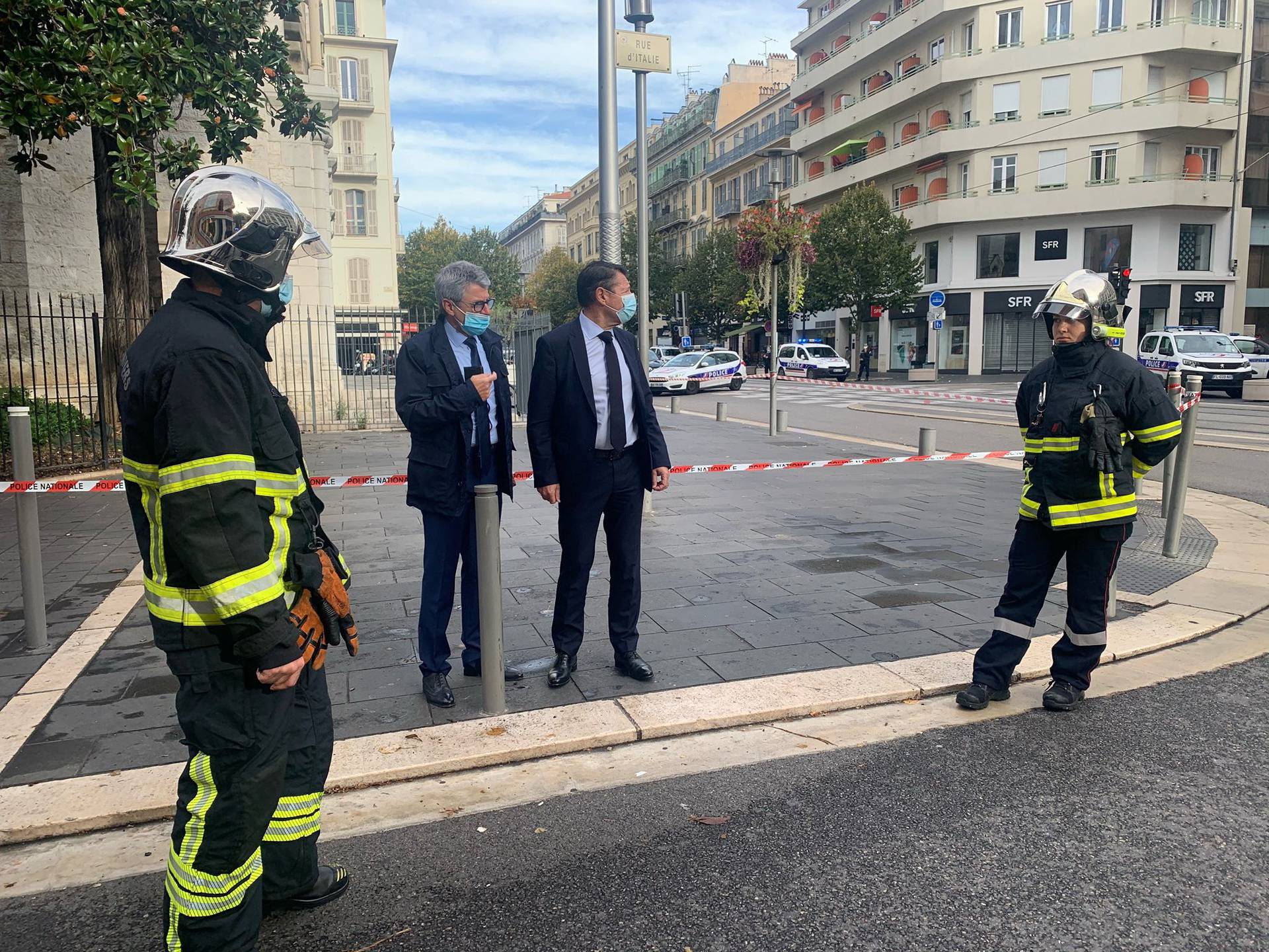 Nice Mayor Christian Estrosi talks to Municipal Police at the site of a knife attack in church in Nice