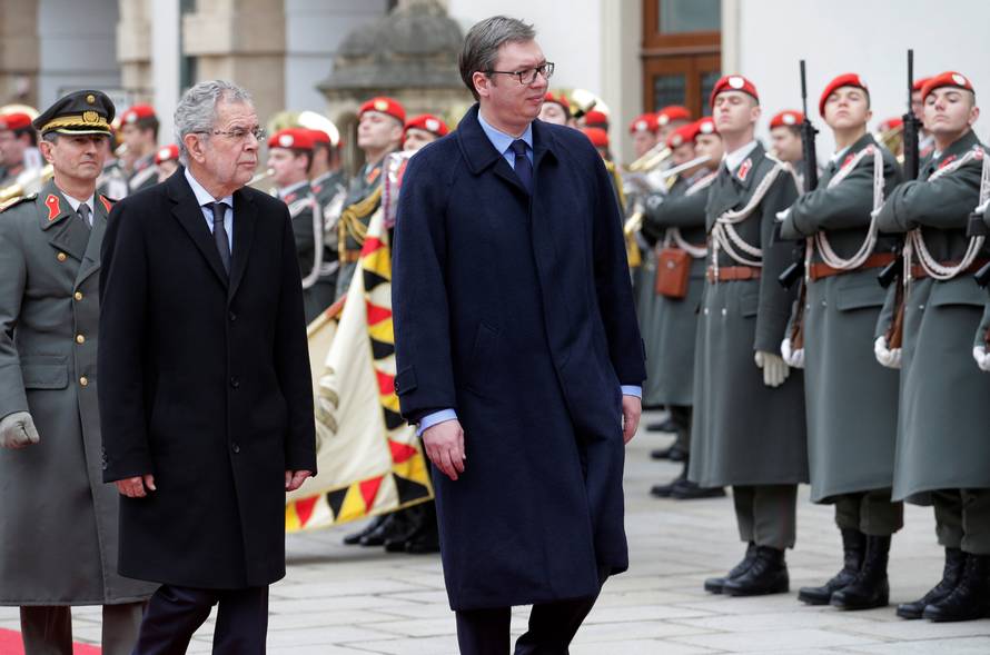 Austria's President Van der Bellen and Serbia's President Vucic review the honour guard in Vienna