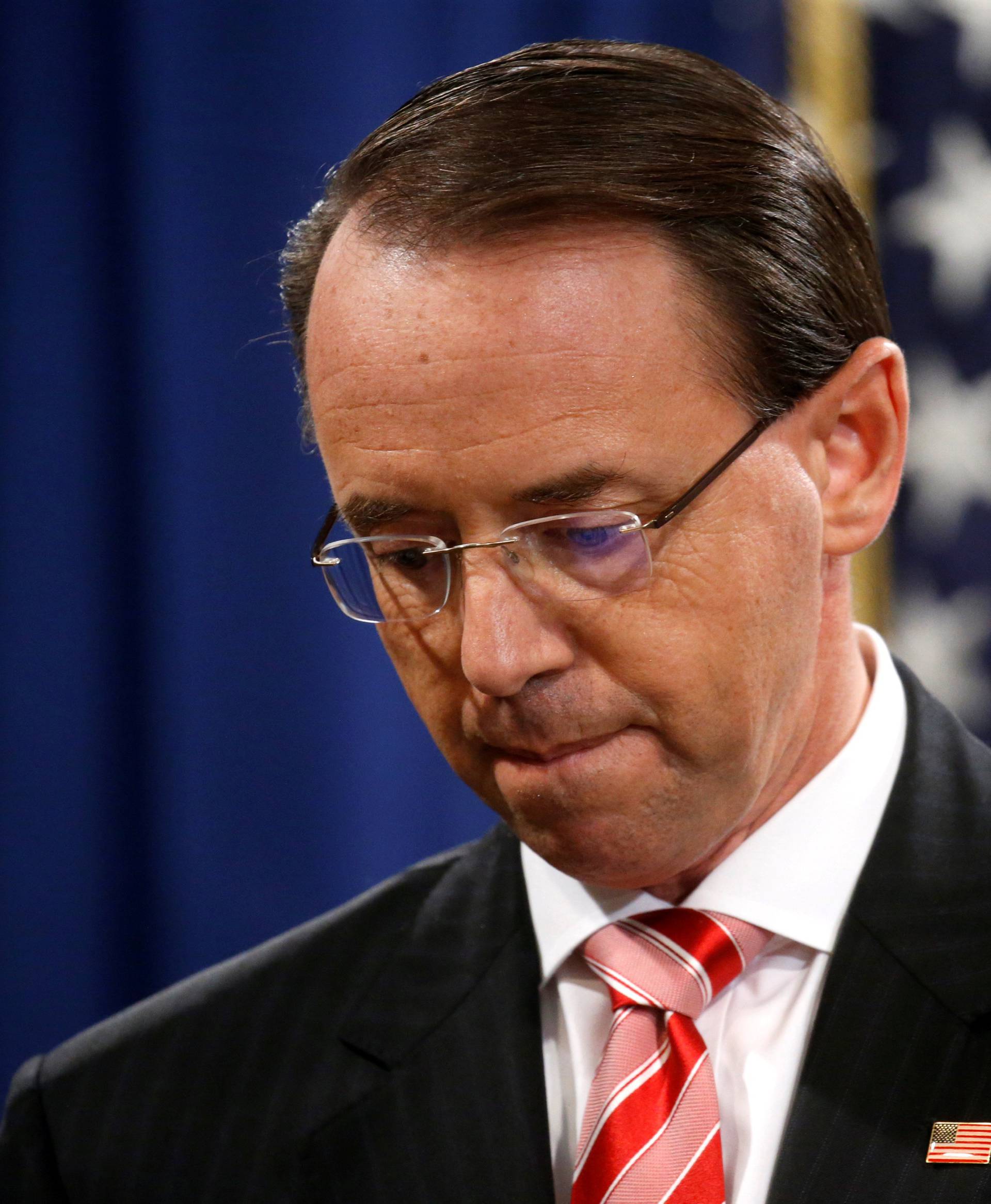 FILE PHOTO: Deputy U.S. Attorney General Rosenstein holds news conference to announce indictments in special counsel Robert Mueller's Russia investigation at the Justice Department in Washington