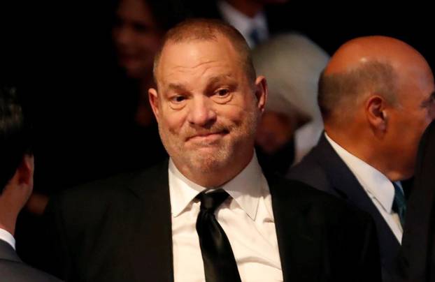 FILE PHOTO: Producer Weinstein stands in the audience ahead of the first presidential debate between U.S. presidential nominee Donald trump and U.S. presidential nominee Clinton in Hempstead