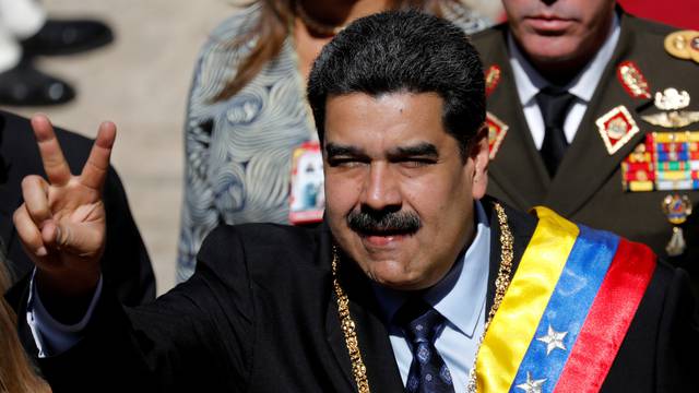 FILE PHOTO: Venezuela's President Nicolas Maduro gestures during the arrival for a special session of the National Constituent Assembly to present his annual state of the nation in Caracas