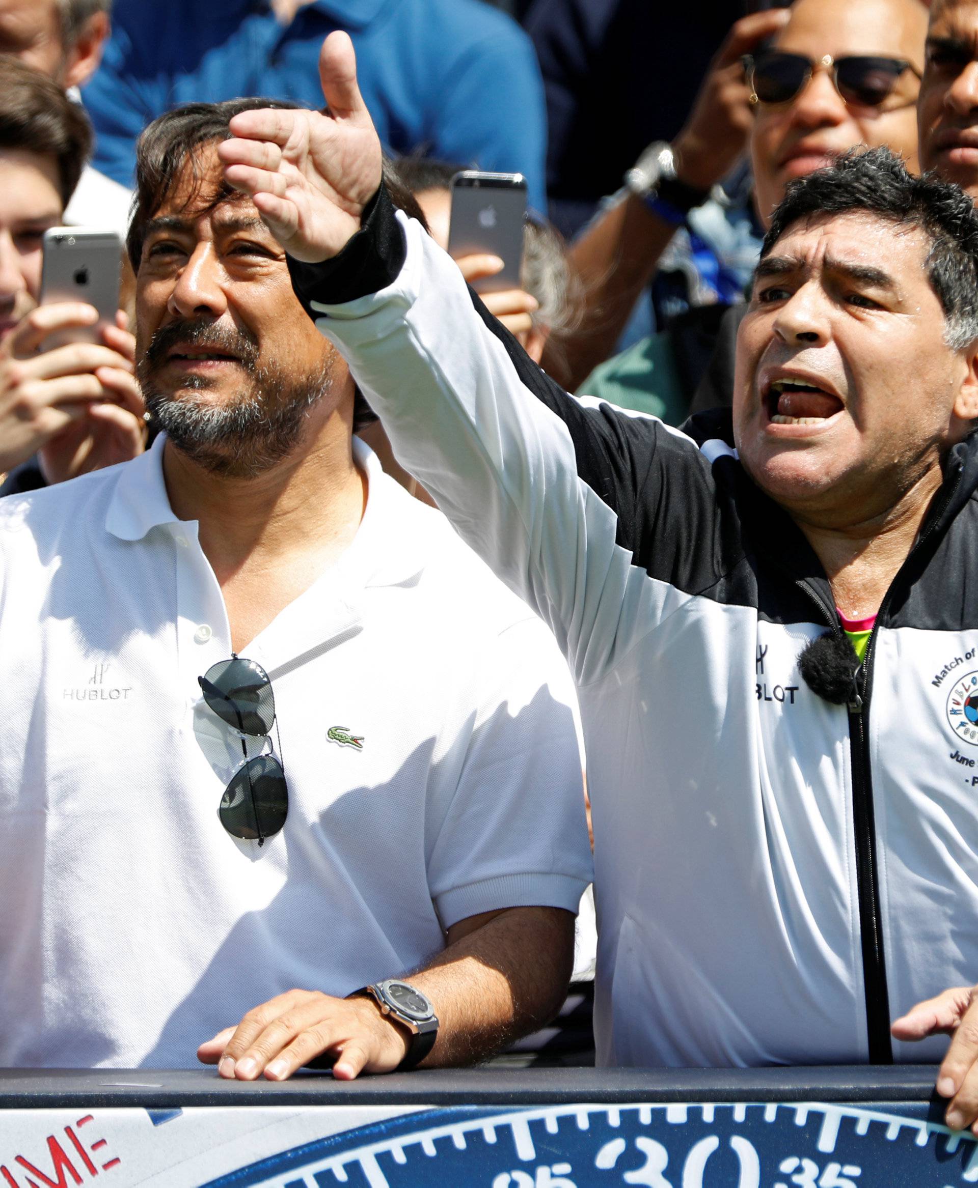 Football legend Diego Maradona reacts during an advertising event on the eve of the opening of the UEFA 2016 European Championship in Paris