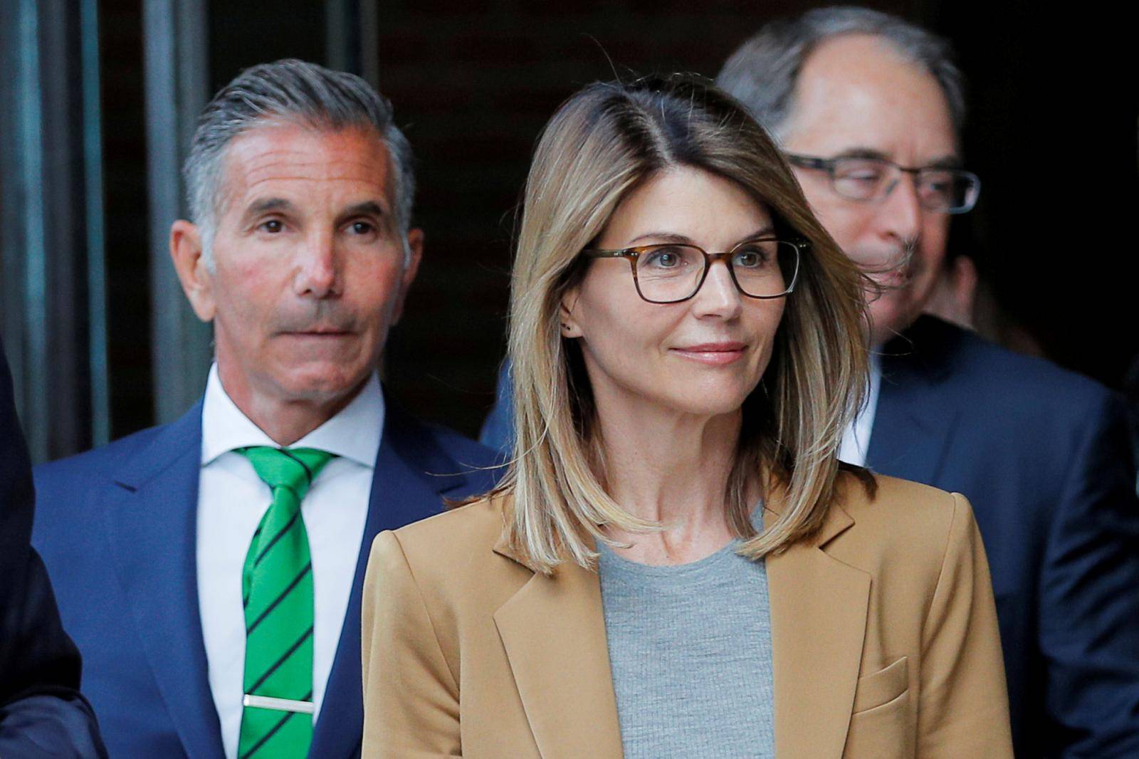 FILE PHOTO: Actor Lori Loughlin and her husband Mossimo Giannulli leave the federal courthouse in Boston