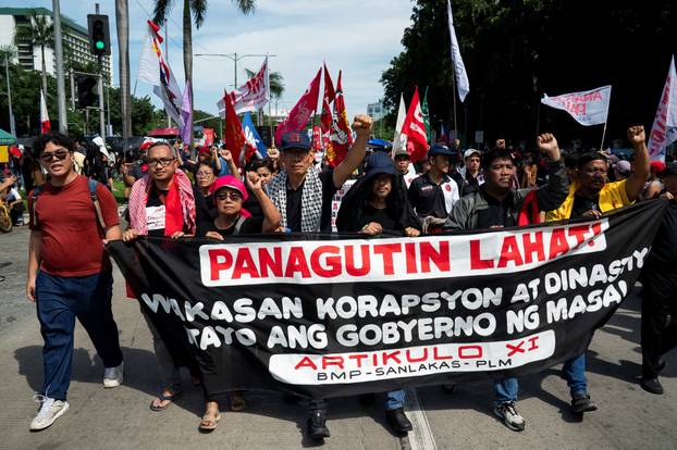 Filipinos gather during a protest denouncing what they call corruption linked to flood control projects