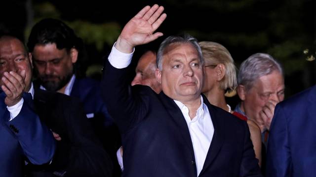 Hungarian Prime Minister Viktor Orban addresses supporters after the preliminary results of the European Parliament election in Budapest