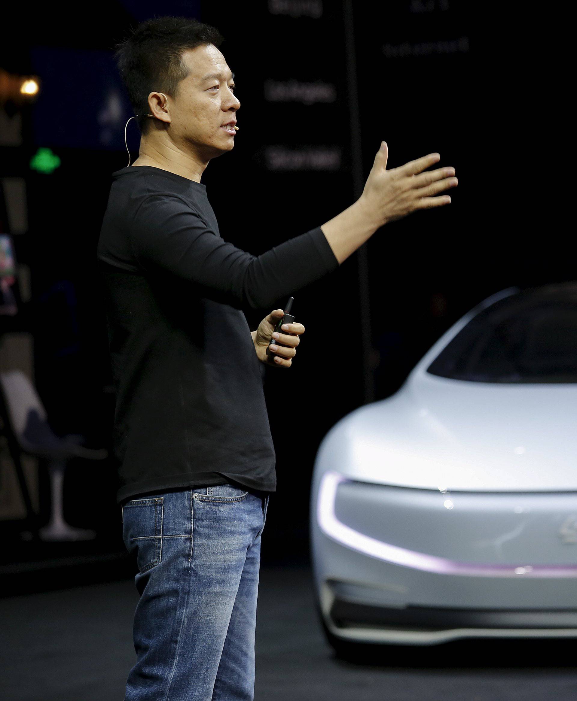 Jia, co-founder and head of Le Holdings Co Ltd, also known as LeEco and formerly as LeTV, gestures as he unveils an all-electric battery "concept" car called LeSEE during a ceremony in Beijing