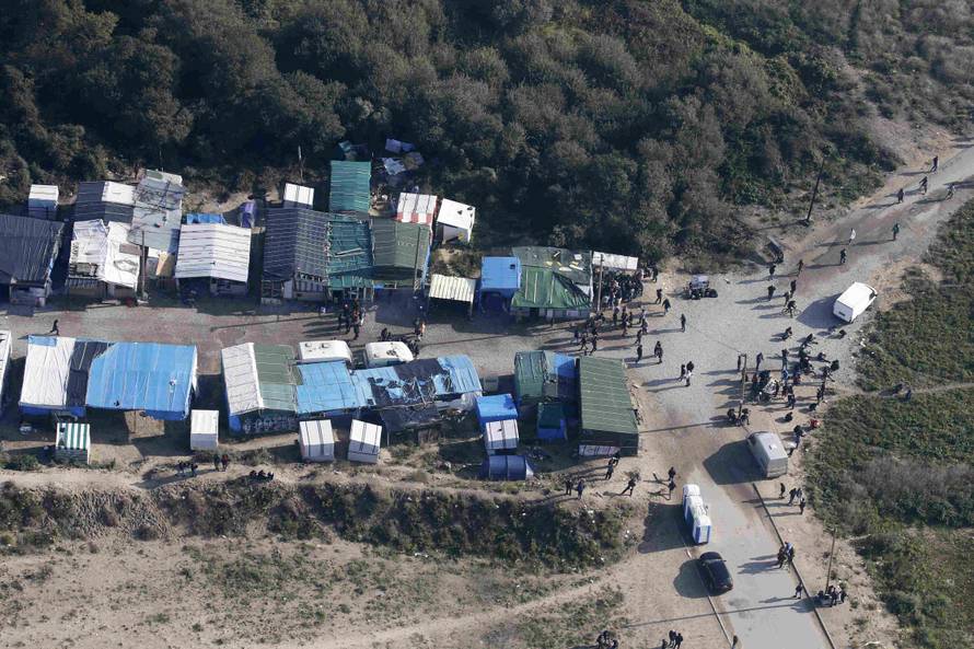 An aerial view shows tents and makeshift shelters on the eve of the evacuation and dismantlement of the camp called the "Jungle" in Calais