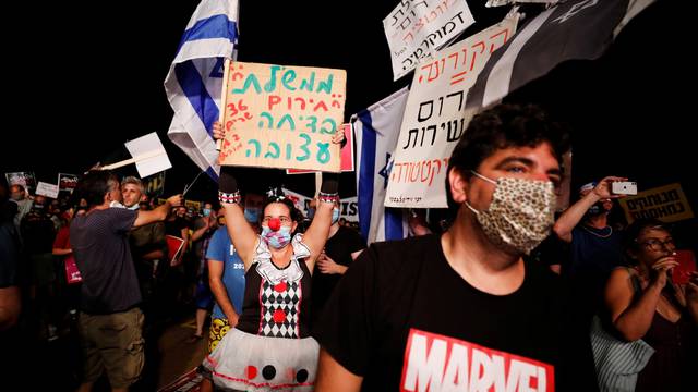 Israelis protest against government's handling of COVID-19 crisis, in Tel Aviv