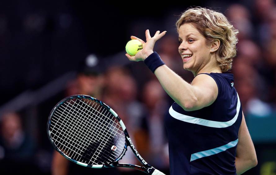 FILE PHOTO: Belgium's Clijsters waves to supporters during an exhibition tennis match to mark her retirement