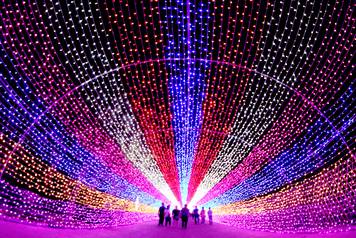 Tourists walk through a lantern installation in Zhangjiakou