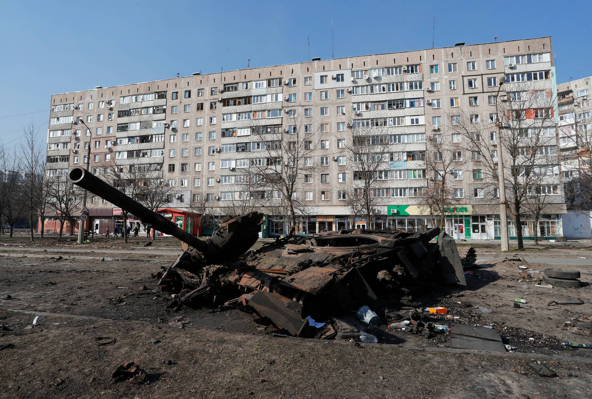 A tank destroyed in fighting during Ukraine-Russia conflict is seen in the besieged southern port of Mariupol