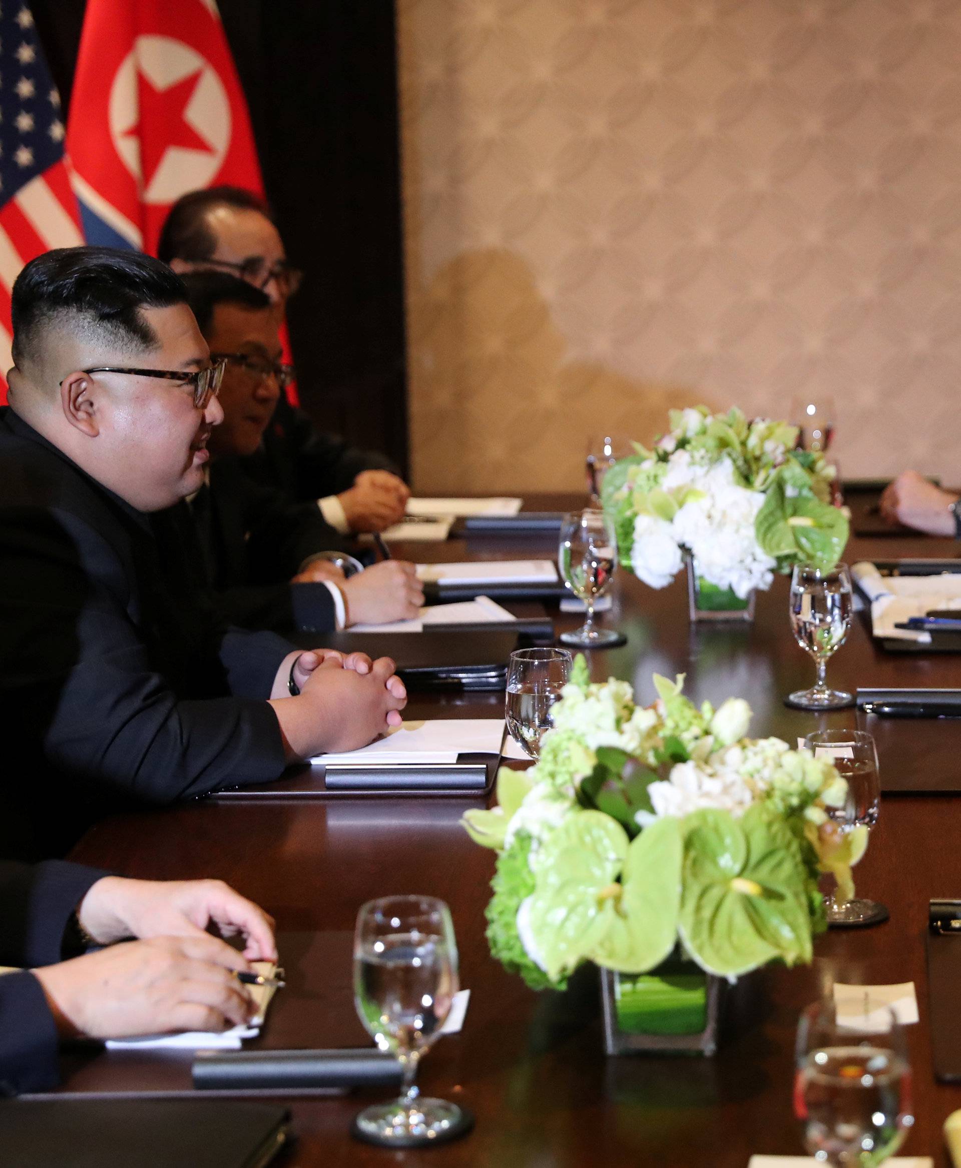 U.S. President Donald Trump is seen with North Korea's leader Kim Jong Un before their expanded bilateral meeting in Singapore