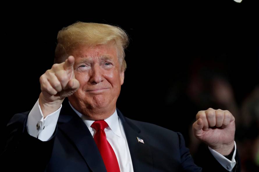 FILE PHOTO:    U.S. President Donald Trump acknowledges supporters at a campaign rally at the Show Me Center in Cape Girardeau Missouri
