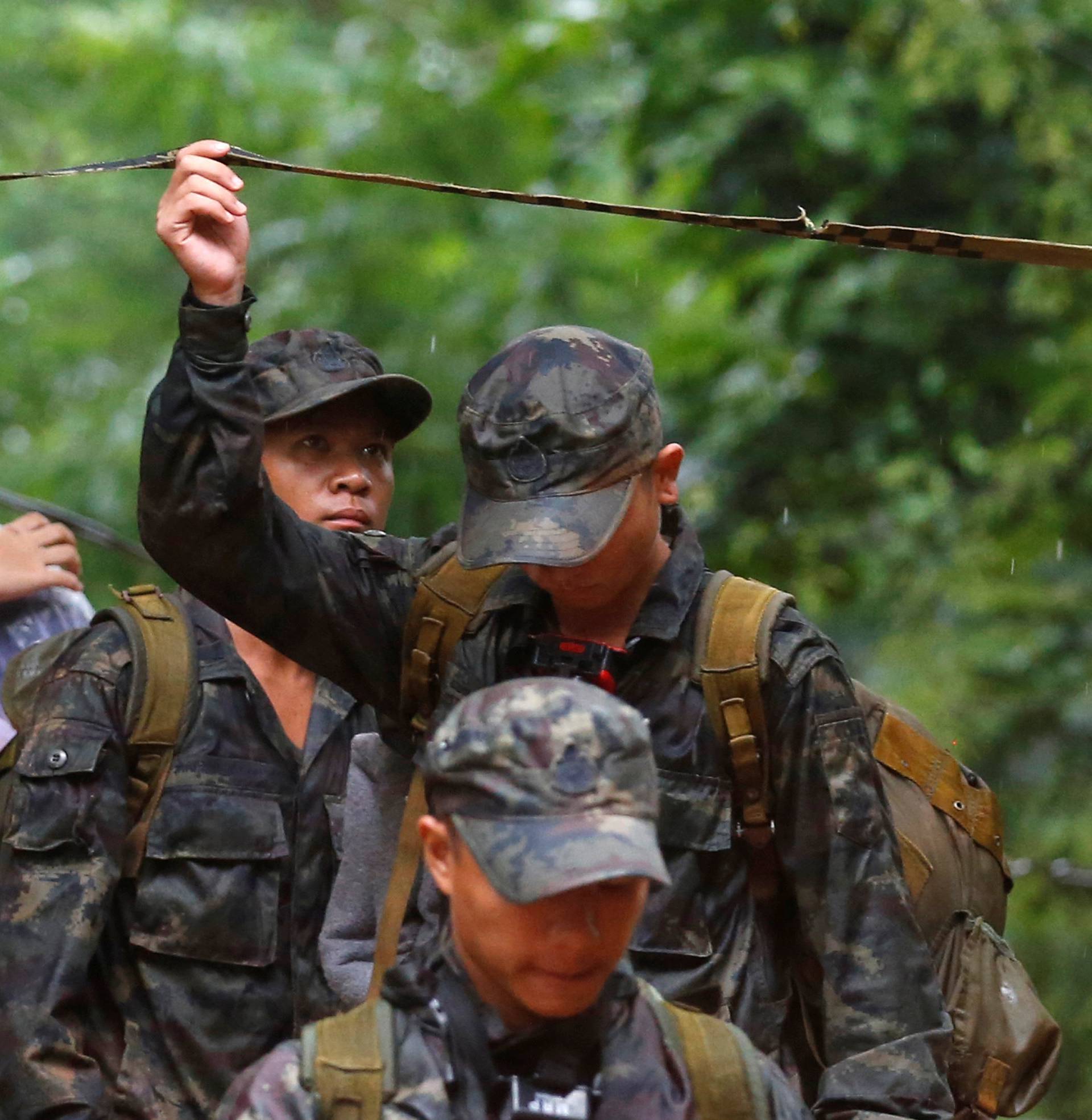 Soldiers work near Tham Luang caves during a search for 12 members of an under-16 soccer team and their coach, in the northern province of Chiang Rai