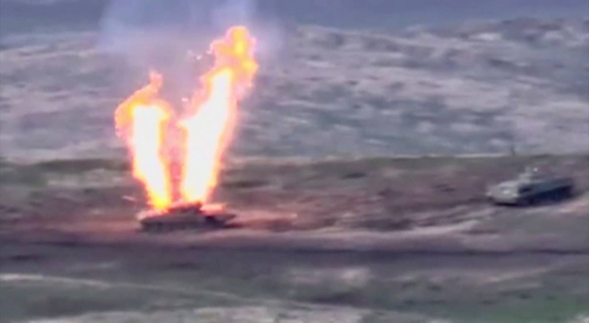 A still image shows what is said to be a destroyed Azerbaijani armoured vehicle in Nagorno-Karabakh