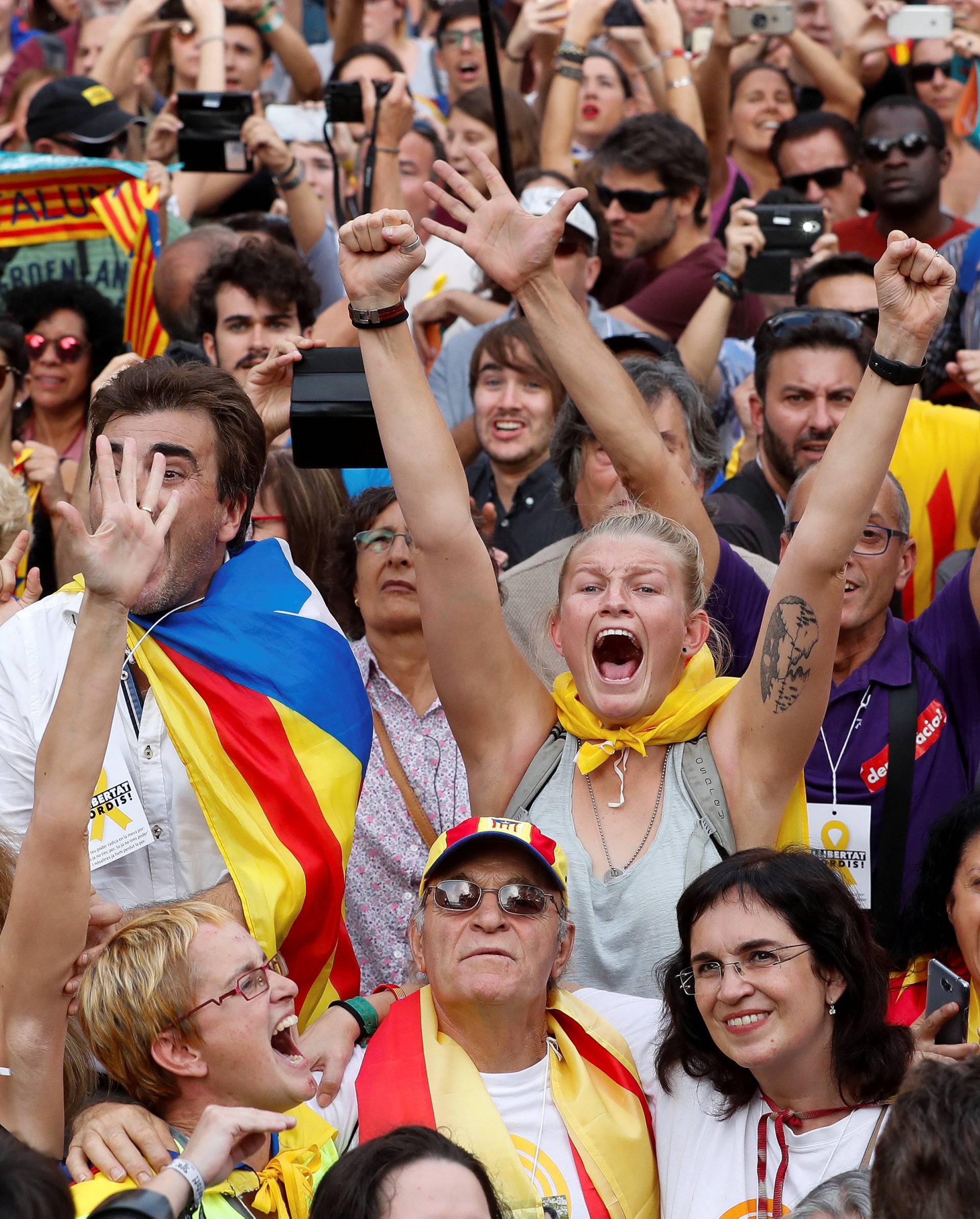 People celebrate as the Catalan regional parliament voted to declare independence from Spain in Barcelona