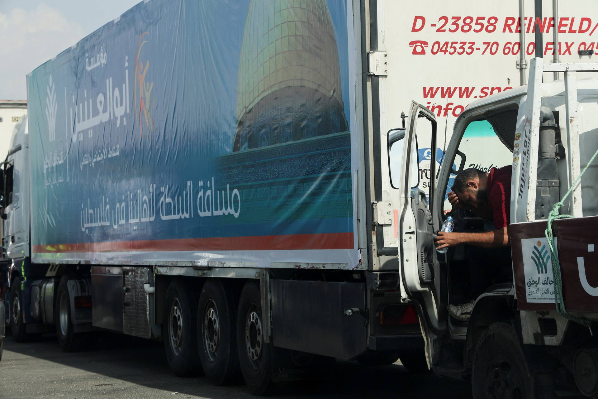 Trucks carrying humanitarian aid to Palestinians are waiting on the desert road (Cairo - Ismailia) on their way to the Rafah crossing