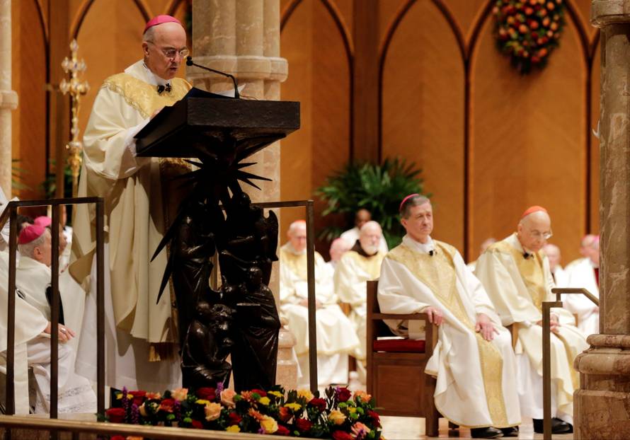 FILE PHOTO: Archbishop Carlo Maria Vigano reads the Apostolic Mandate during the Installation Mass of Archbishop Blase Cupich at Holy Name Cathedral in Chicago
