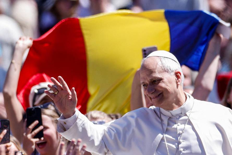 Pope Leo XIV delivers his "Urbi et Orbi" (To the city and the world) message from the main balcony of St. Peter's Basilica