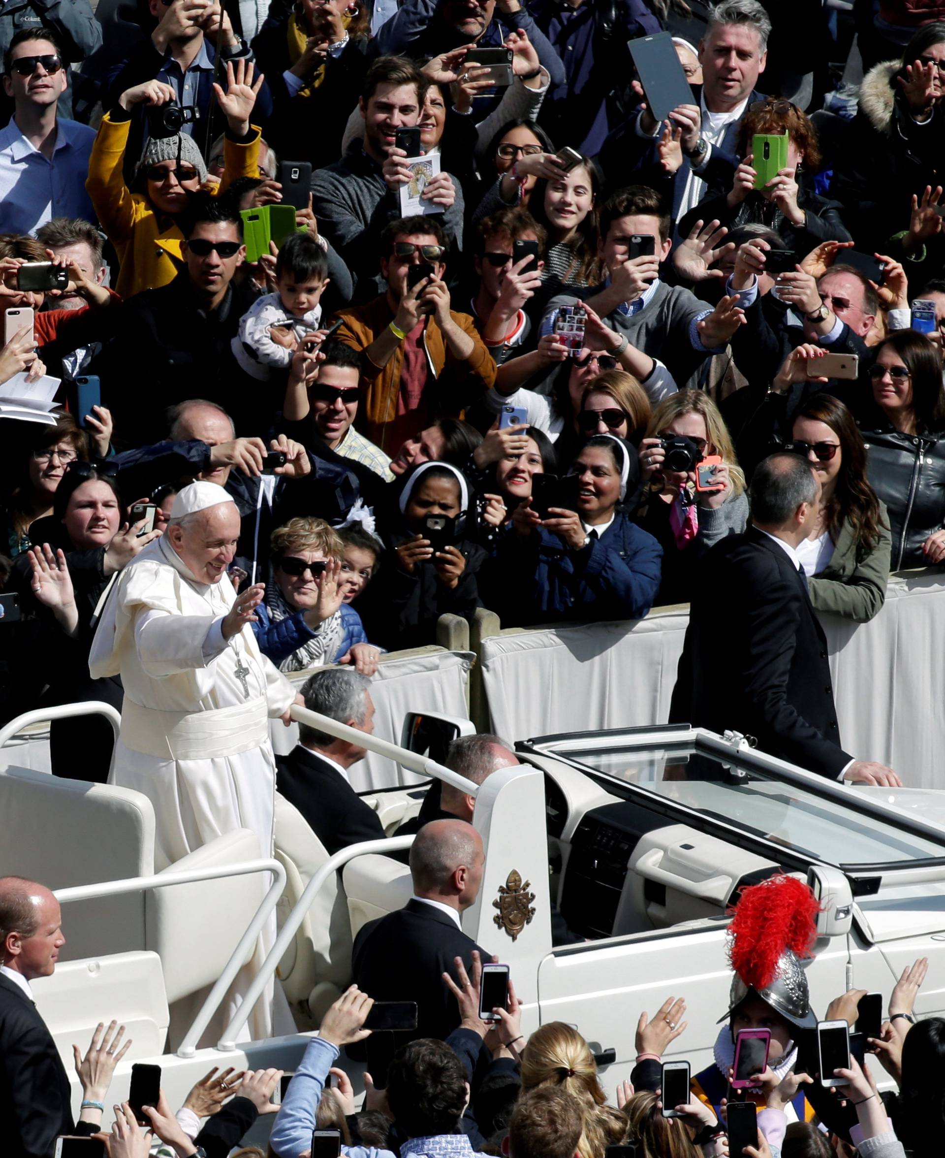 Pope Francis waves from his Papamobile after the Easter Mass at St. Peter's Square at the Vatican